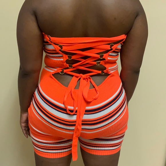 Multicolored romper w/ the back out. - Picture 3 of 4